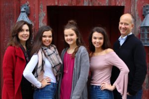 A recent picture of my wife and I with our three daughters.